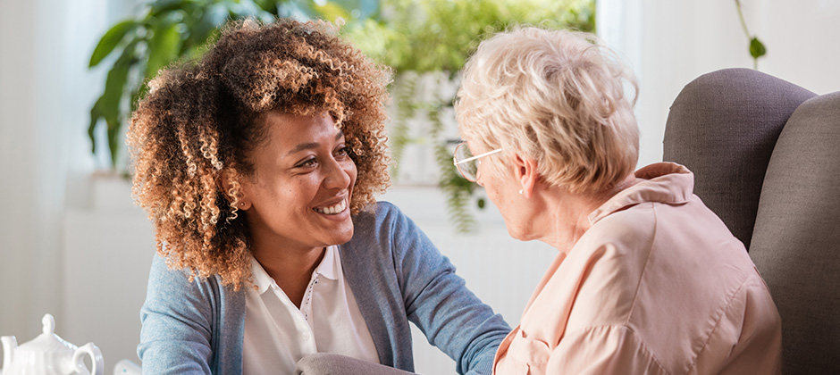 A woman looking after an older lady